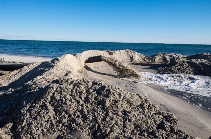 Fresh sand dredged from Eel Pond in Edgartown helps replenish Fuller street beach -Mark Lovewell